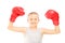 Happy child with red boxing gloves gesturing triumph