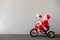 Happy child riding bike. Christmas holiday concept