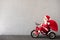 Happy child riding bike. Christmas holiday concept