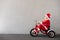 Happy child riding bike. Christmas holiday concept