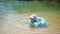 A happy child swims in an inflatable circle in the sea