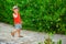 Happy child walking on stairs on nature background