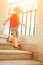 Happy child walking on stairs on nature background
