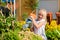 Happy child watering flowers