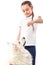Happy child with white dog. Portrait girl with eating pet. Smilyng Samoyed Laika dog.