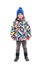 Happy child in winter clothes standing. Cute boy in a hat with a pompon and a scarf.  on white