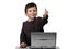 Happy child working on laptop with thumbs up