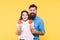 Happy childhood. Daughter and father eat candy. bearded hipster man is good dad. little girl child and dad hold colorful