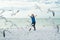 Happy childhood. Happy child running with seagull birds, having fun on the beach on a hot summer day. Summer holiday