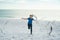 Happy childhood. Little kid boy having fun on Miami beach. Happy cute child running near ocean hunting seagull birds on