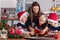 Happy children, boy brothers and mother, baking christmas cookies at home