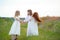 Happy children dancing on a field, healthy life, kid`s togethern