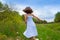 Happy children girl jumping on spring poppy flowers