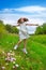 Happy children girl jumping on spring poppy flowers