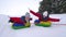 Happy children have fun riding snow saucer and laugh on snowy winter road on winter frosty day. Teens play on sled in