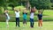 Happy children jumping together in park