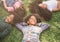 Happy children kids laying on grass in park.