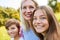 Happy children and mother together in the park