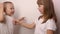 Happy children play game rock paper scissor on white background, smile and laugh