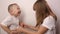 Happy children play game rock paper scissor on white background, smile and laugh