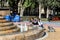 Happy children playing in a water fountain in a hot day