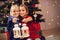 Happy children posing with Christmas lanterns