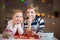 Happy children preparing cookies for Christmas and New Year