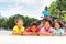 Happy children resting after cycling outdoors