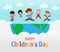 Happy children`s day background poster with happy kids jumping on World in the cloudy sky and rainbow greeting card isolated