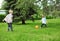 Happy children two boys together playing football with ball