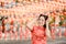 Happy Chinese new year. Asian woman wearing traditional cheongsam qipao dress posing rabbit in Chinese Buddhist temple. Celebrate