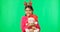 Happy, Christmas and face of a child with a teddy on a green screen isolated on a studio background. Bear, smile and