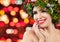 Happy Christmas woman smiling on bright bokeh sparkle background