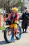 Happy clown on a bike in a small town parade