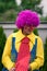 Happy clown with violet wig