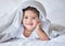 Happy, comfy and portrait of a baby on a bed to relax, sleep and rest with a blanket. Smile, cute and adorable girl