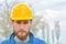 Happy confident bearded young man in helmet