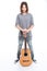 Happy confident young man standing with guitar