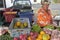 Happy Cook Islander woman sale fresh produce at Punanga Nui Mark