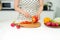 Happy cooking. Young asian woman cutting vegetables for salad in