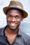 Happy cool african american man smiling with hat