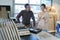 Happy couple adults choosing ceramic tile for bathroom