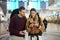 Happy couple, airport and phone with ticket, travel app and adventure with excited face, conversation and smile. Man