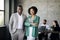 Happy Couple Of Black Coworkers Posing At Modern Office Interior