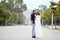 Happy couple bride and groom tenderly embraced in wedding day in Napoli, Italy