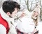 Happy couple building snowman