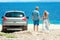 A happy couple cars by the sea in nature weekend travel