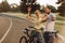 Happy couple of cyclists having fun outdoors.