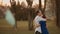 Happy couple dances after coronavirus epidemic ends, surgical mask hangs in foreground