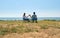 Happy couple on date admire beautiful landscape while sitting on travel chairs